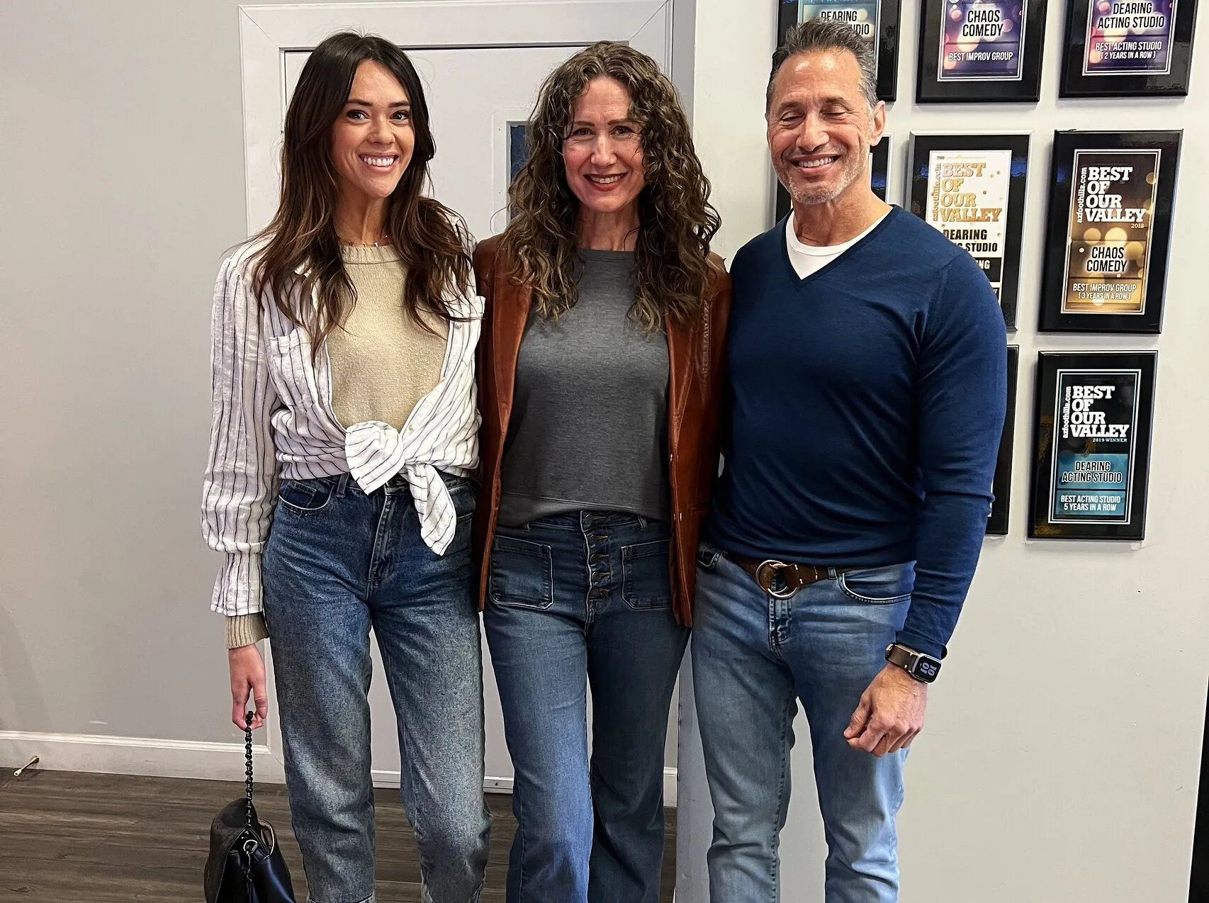 Three actors after a session in the studio hallway